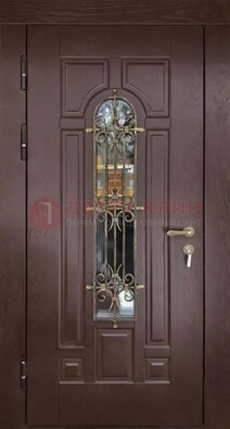 Темная железная дверь со стеклом и ковкой для частного дома ДСК-156 в Екатеринбурге
