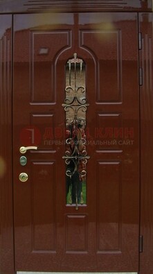 Красивая металлическая дверь со стеклом и ковкой ДСК-33 в Екатеринбурге